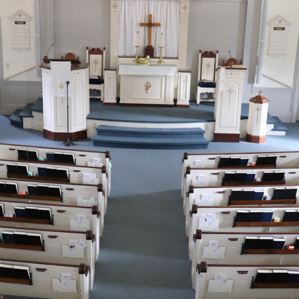 Picture of the church sanctuary without people with white paraments